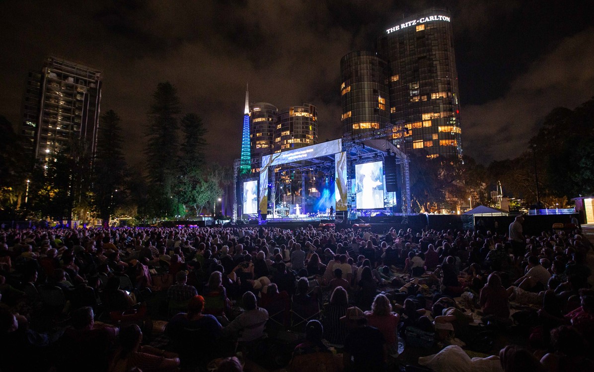 Image of audience members and stage at opera in the park