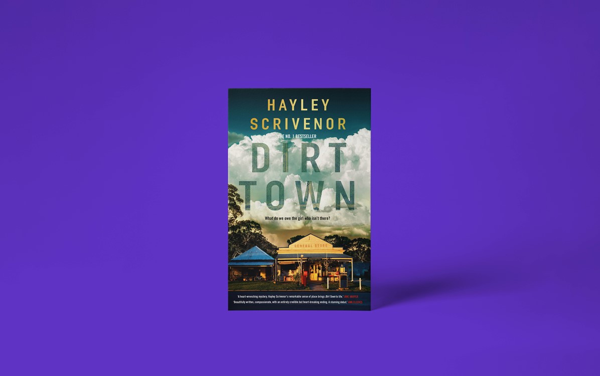 A book cover with the title 'Dirt Town' by Hayley Scrivenor with a purple background