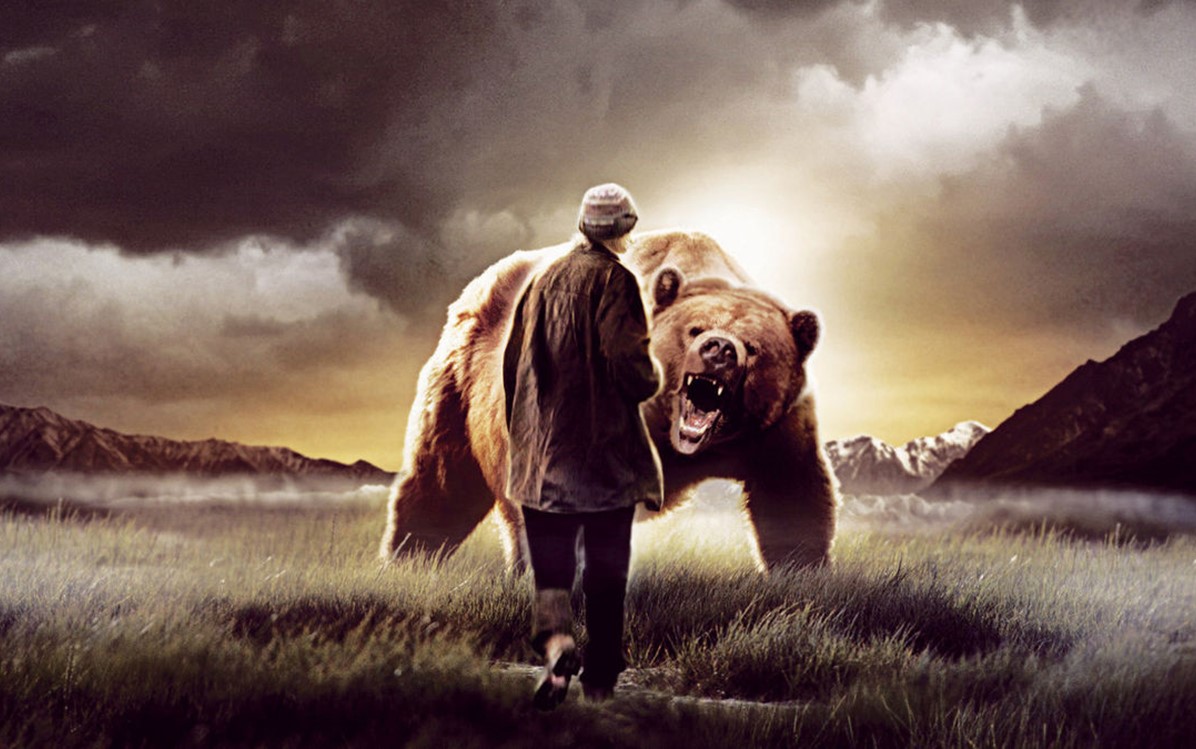 Image of a man facing a grizzly bear in ''The Grizzly Man''