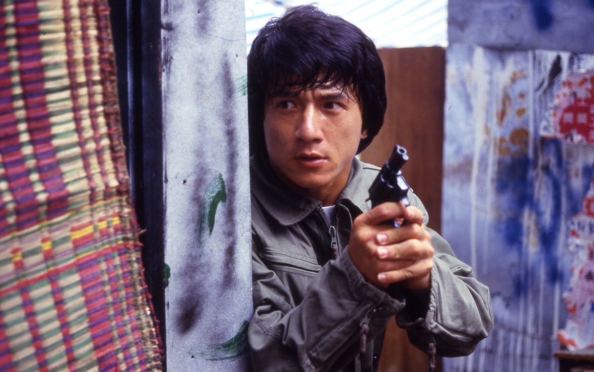 Image of Jackie Chan with a gun from 'Police Story 1'