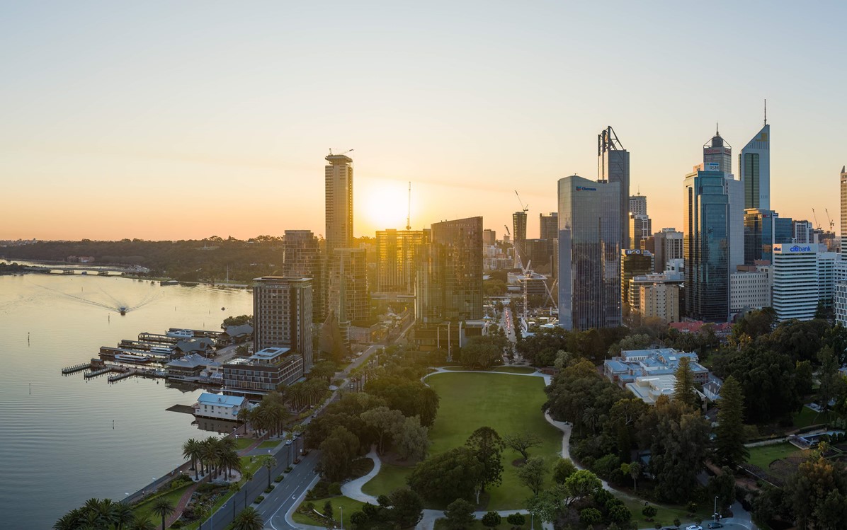 Perth city skyline at sunset with Supreme Court Gardens in the forefront