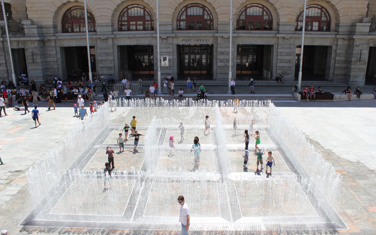 Image of children playing in Jeppe Hein's water fountain installation Appearing Rooms in Forrest Place.