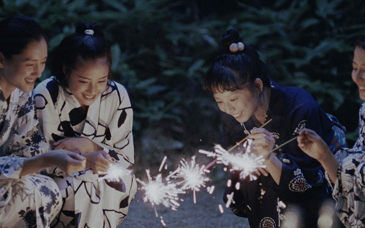 Image of 4 women with sparkling candles from the movie ''Our Little Sister''